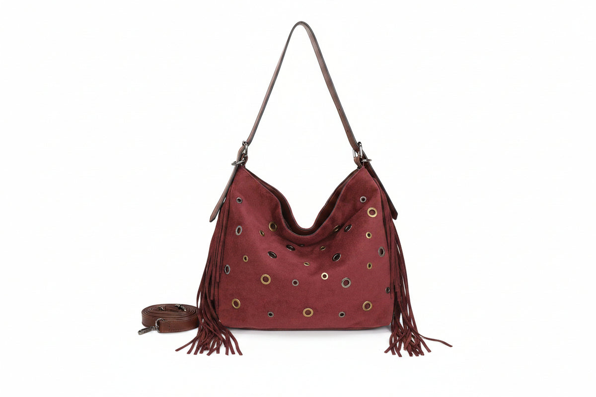 Bolso de hombro suave en ecopiel afelpada con flecos y ojales metálicos